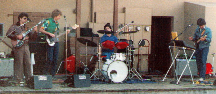 Whale's Knees in the mid 80's with guitarist/singer, Glen Rathbone, Bassist and singer, Jim Sylvester, Drummer and Singer, Steve Boydston, and a permed up me. We were playing at the back side of the Cayucos Tavern on a Sunday likely. Fun gig under the influence of the cool sea salt air...